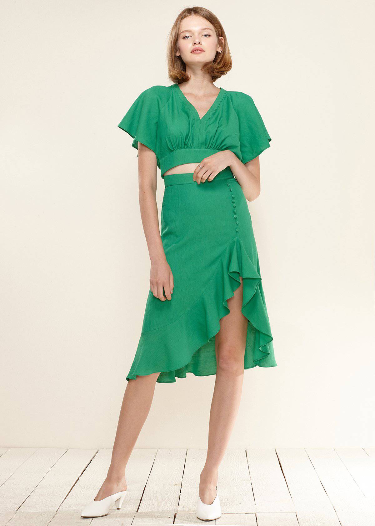 Women's Asymmetrical Hem Button Front Skirt in Kelly Green by Shop at Konus
