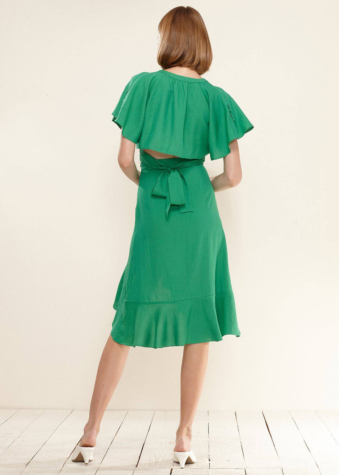 Women's Asymmetrical Hem Button Front Skirt in Kelly Green by Shop at Konus