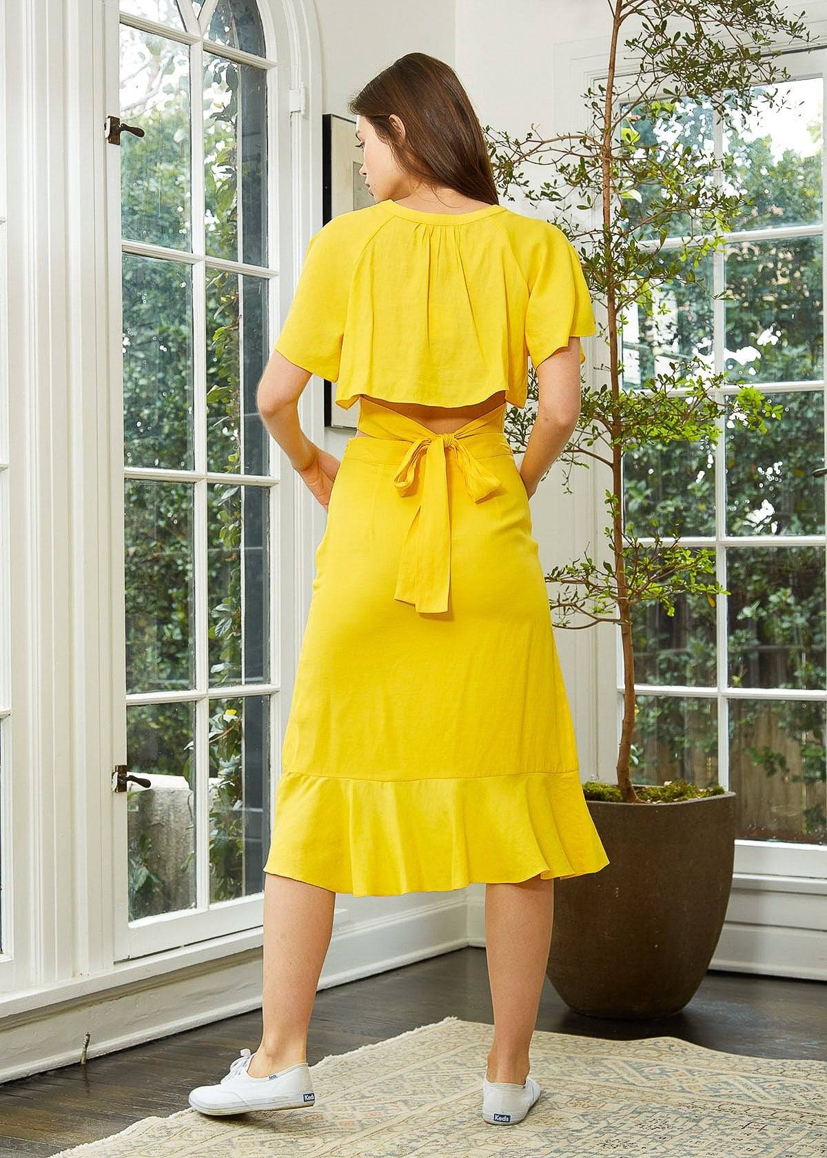 Women's Asymmetrical Hem Button Front Skirt in Yellow by Shop at Konus