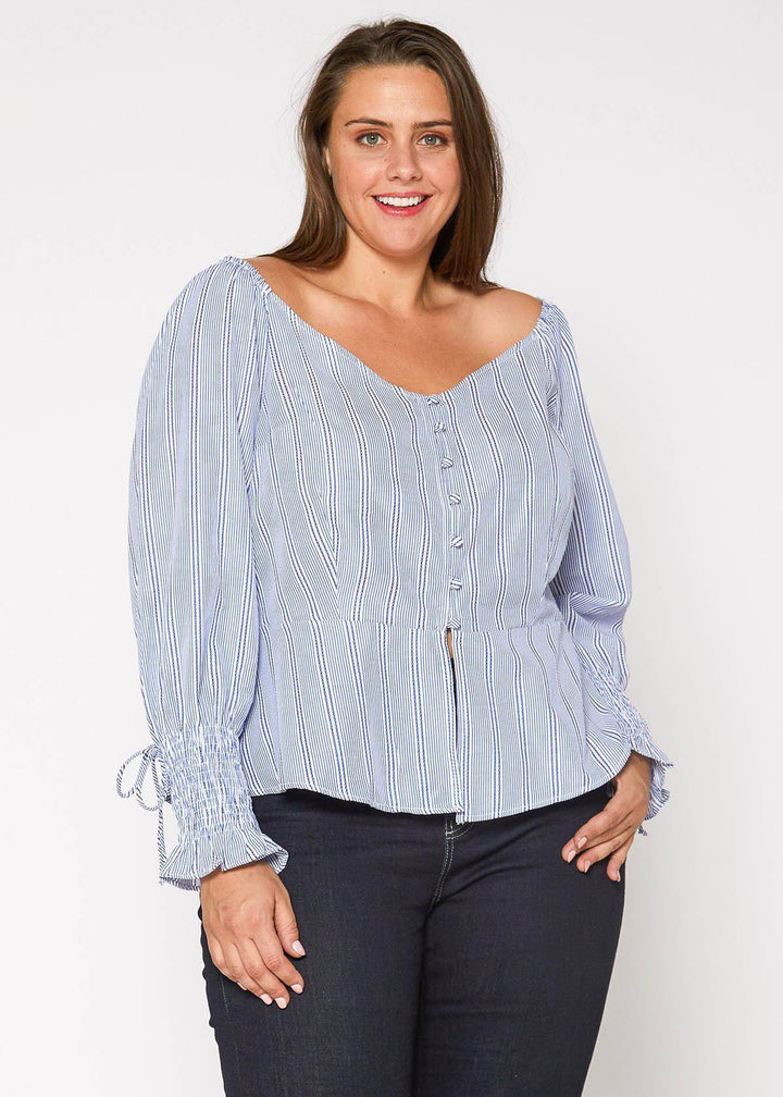 Plus Size Smocked Sleeve Wrap Blouse in Blue by Shop at Konus