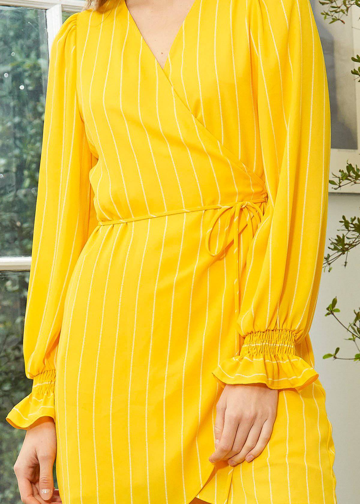 Smocked Bell Sleeve Wrap Dress in Yellow by Shop at Konus
