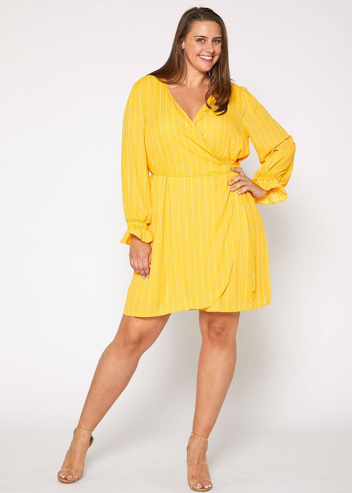 Plus Size Smocked Bell Sleeve Wrap Dress in Yellow by Shop at Konus