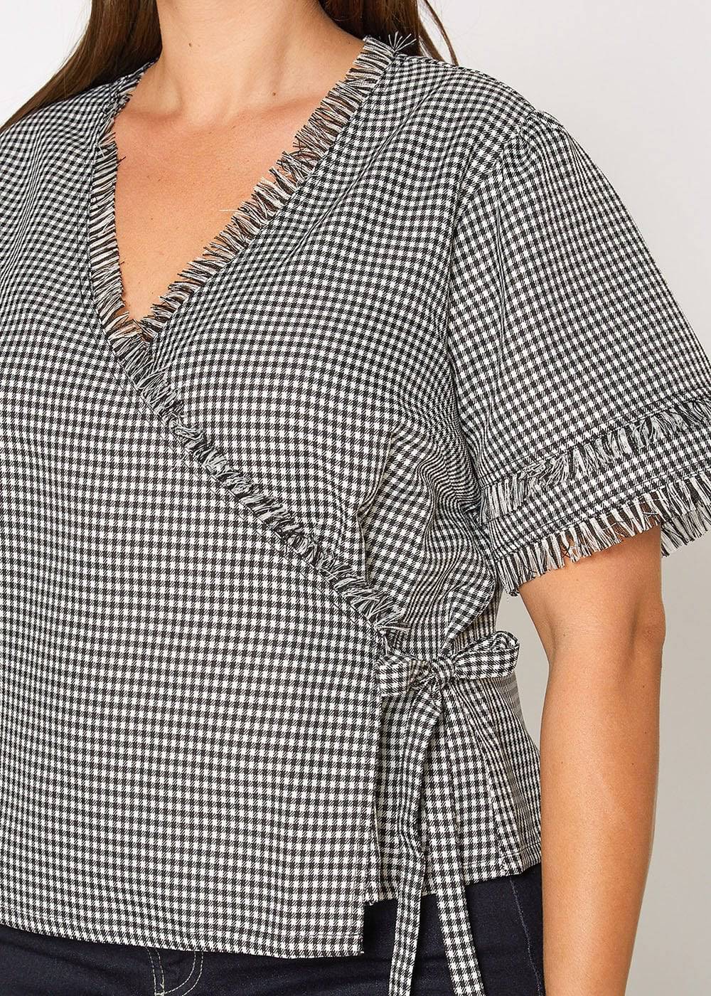 Plus Size Fringe Trim Gingham Wrap Blouse in Black Gingham by Shop at Konus