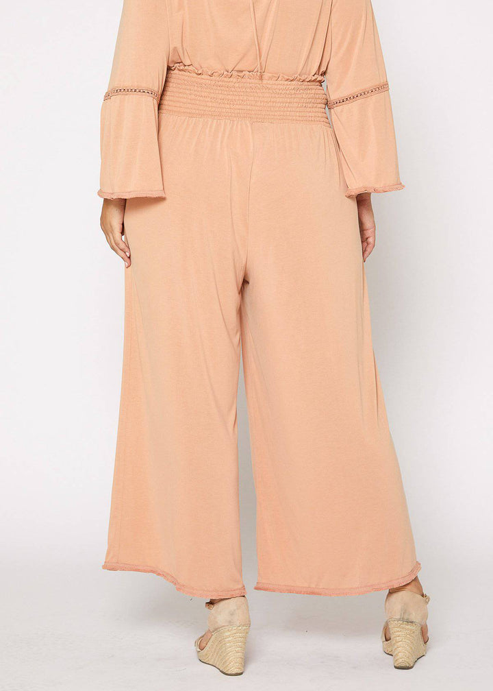 Plus Size Smocked Waist Wide Leg Palazzo Pants in Apricot by Shop at Konus