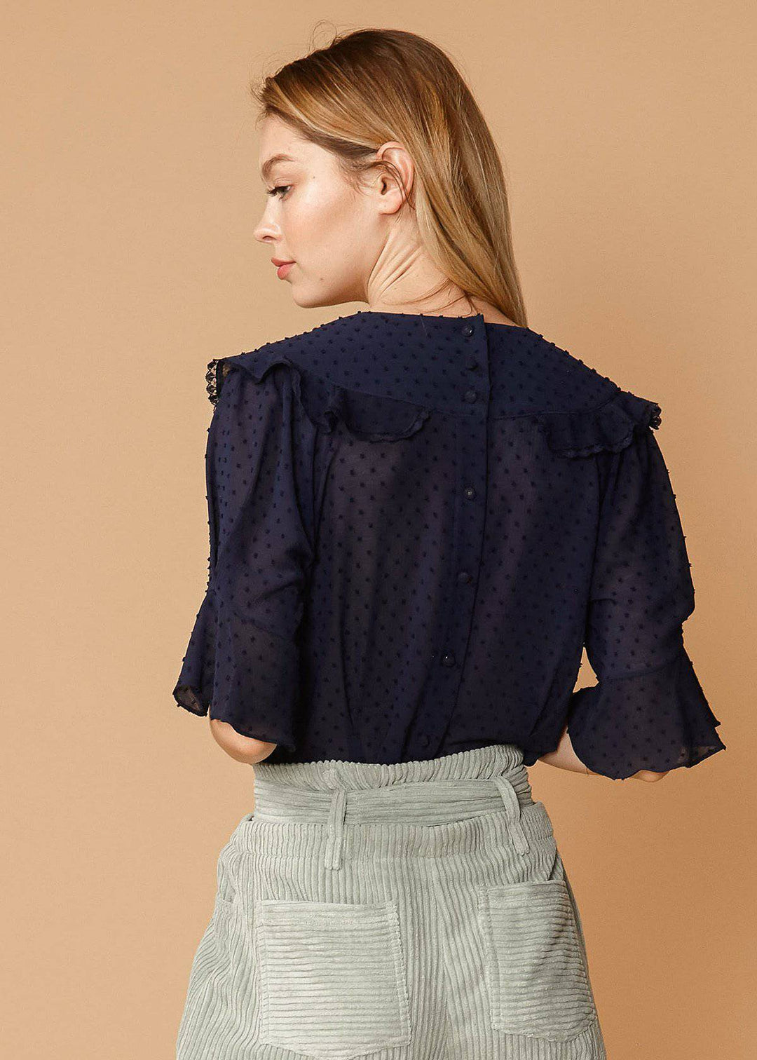 Women's Swiss Dot Ruffle Sleeve Top in Midnight by Shop at Konus